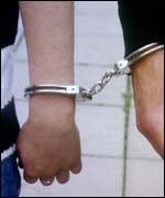 Handcuffed accused