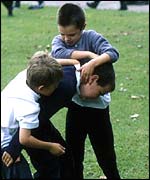 Boys play fighting