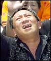 A Balinese man mourns for victims of the attack