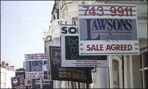 A street full of for sale signs