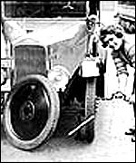 Woman changing tyre