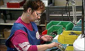 A woman working in a factory
