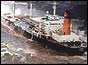 Stricken tanker Braer aground off the Shetland islands, sea washing over deck