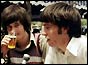 Two of the plane-spotters relax with a beer after their ordeal