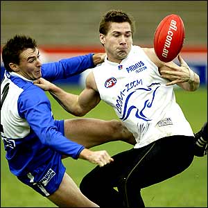 Shannon Grant grabs the ball during a Kangaroos training session in Melbourne 