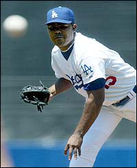 Starting pitcher Odalis Perez of the Los Angeles Dodgers throws against the Arizona Diamondbacks during the third inning of the MLB game at Dodger Stadium 
