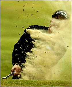 US golfer Phil Mickelson plays out of the sand at the Open