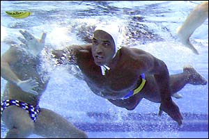 Spain's Ivan Perez dives underwater to get the ball