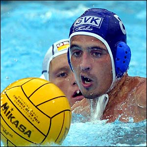 Slovakia' Milan Cipov (right) fights for the ball during his side's FINA water polo World Championship match against Germany