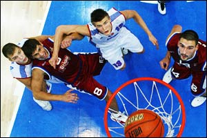 Russian and Croatian players look on as Russia score a crucial basket