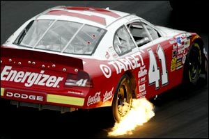 Casey Mears' car lets out flames during the NASCAR Winston Cup