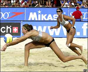 Kerry Walsh stretches to reach the ball watched by partner Misty May in the beach volleyball Grand Slam tournament in Austria