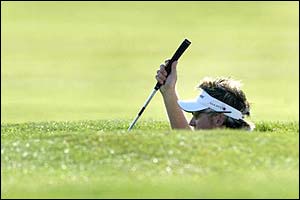 Ian Poulter lines up a bunker shot at the German Masters