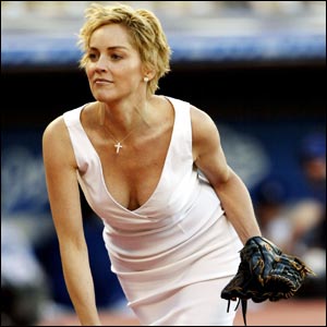 Actress Sharon Stone prepares to deliver the first pitch before the Los Angeles Dodgers take on the Cincinnati Reds at Dodgers Stadium in Los Angeles, California