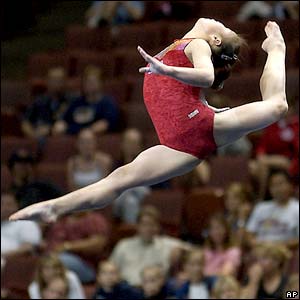 Korea's Kwang Sun Pyon leaps as she performs her floor routine during women's qualifying at the 2003 World Gymnastics Championships