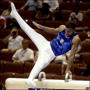 Cuba's Charles Leon Tamayo competes in the pommel horse during men's qualifying at the 2003 World Gymnastics Championships