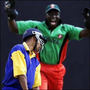 Gayan Wijekoon of Sri Lanka looks despondent as he is caught by Kenya's wicket-keeper Kennedy Obuya during a friendly match in Nairobi