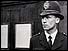 Policeman with execution notices