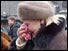 Elderly woman weeps
