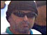 Man in dark glasses and black hat