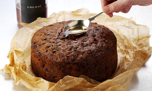 Feeding a Christmas cake brandy