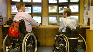 wheelchair_two_men_303_170.gif