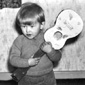 Music man - Joby aged 2 holding his toy guitar. A sign of things to come