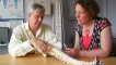 Pennie meets with Pain Specialist Dr Jonathan Banister at Ninewells Hospital. He is highlighting the part of Pennie's spine which is damaged.