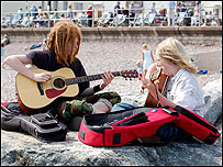 Young musicians on the beach