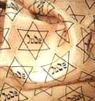 Photograph showing a sample cloth used to make yellow stars