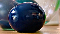A raw, shell-less, and blue egg.