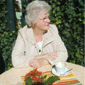 On her travels - Marie enjoying an al fresco coffee on a recent trip to Italy