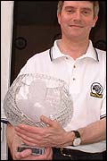 Paul Mortimer shows off the bowl which will be presented to Cloughie by the RamsTrust