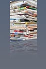 A pile of newspapers and magazines
