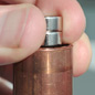 profile close-up of magnet in copper pipe