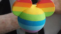 Rainbow coloured Mickey on Liz's wheelchair joystick