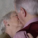 Liz and Malcolm kissing.