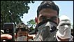 Mask-wearing Kashmiris with camera phones