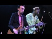 Justin Adams with Juldeh Camara live at the Old Fruitmarket. Photo by Louis Decarlo
