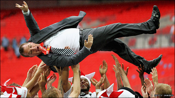 Rodgers is given Guardiola-style bumps by the Swansea players