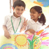 Children show the art they have created for their world peace project