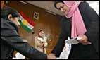 A woman at the ballot box