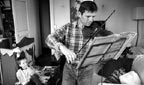 A man playing his violin