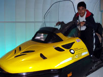 Ravishaan rides the snowmobile