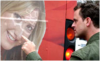 Scott defaces the Laura bus
