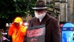 Promoting the show 'Kinder Transport' in the rain
