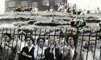 Crowds gather anxiously awaiting news on the miners trapped in the coal and dust explosion.