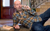 Dominic Byrne uses an office phone