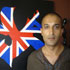 Presenter Adil Ray posing with Islamic art