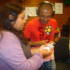 Sonal counts the Monopoly Money given to her by Adil